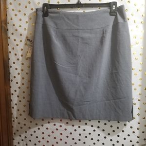 A grey short skirt with small split on each side